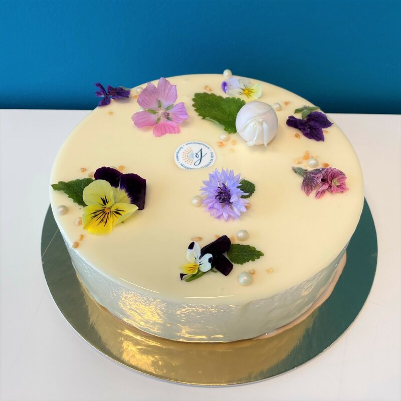 Entremet cake with edible flowers (in season)